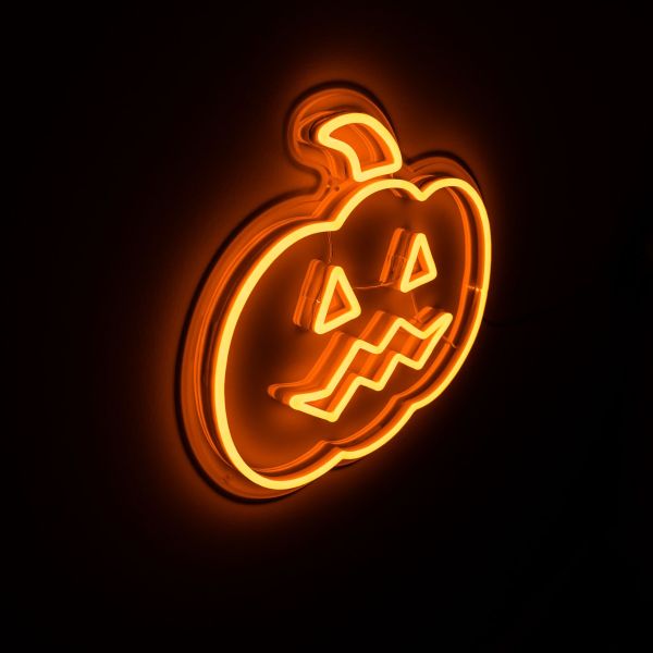 Spooky Light Up Jack O Lantern in pumpkin orange shown illuminated in a dark setting - CUSTOM NEON® Halloween Decorations