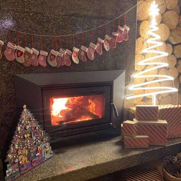 White light up Xmas tree surrounded by a modern wood fireplace, Christmas decorations & presents - by CUSTOM NEON® 