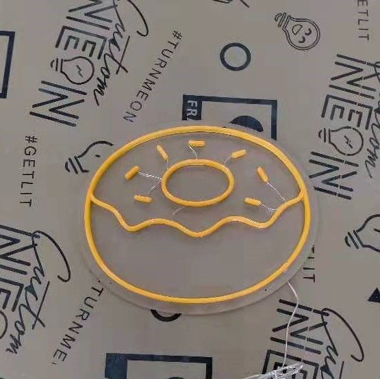 Orange donut with sprinkles LED neon sign shown turned off - made by Custom Neon®