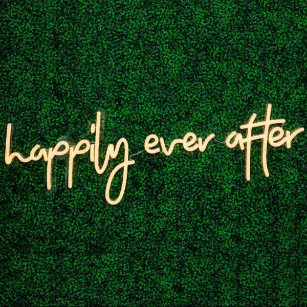 Happily Ever After Portable LED Neon Sign on green wall - photo from CustomNeon.co.uk