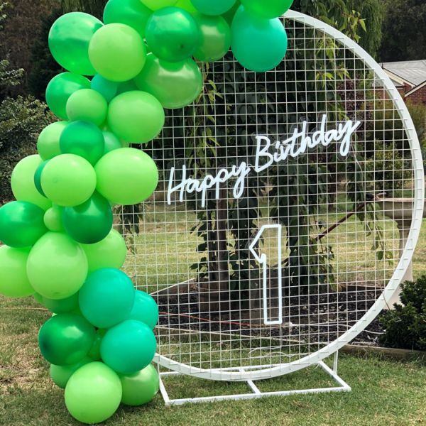 Custom Neon's Happy Birthday LED on mesh with a light up number 1 and green balloons - photo from CustomNeon.com