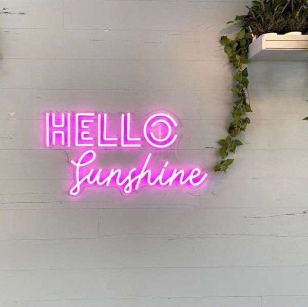 HELLO Sunshine pink neon light on a white wooden wall - made by @customneon for @offthemat_withemma