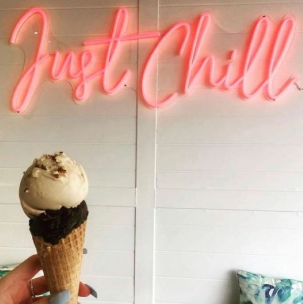 Just Chill faux neon sign in red shown wall mounted as home decor - from Custom Neon®