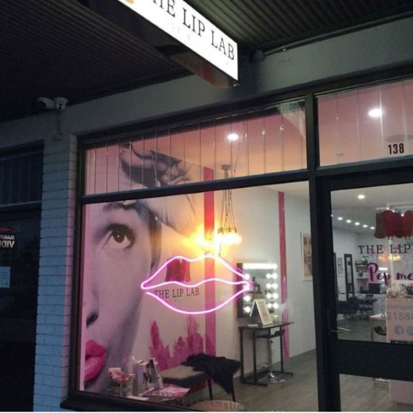 LED neon flex lips light shown in pink as a storefront window sign - from Custom Neon®