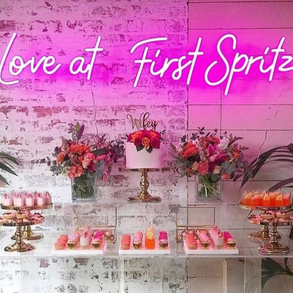 Love at First Spritz LED Neon sign shown at a wedding party - sign by CustomNeon.co.uk