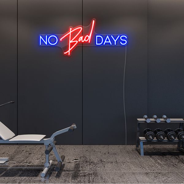 No Bad Days Sign by CUSTOM NEON® shown in dark blue & red on slate grey wall in fitness studio