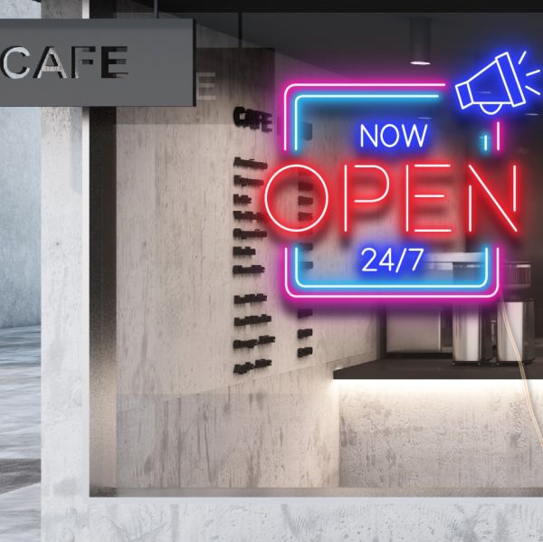 NOW OPEN 24/7 LED Neon Multi-Color Open Sign in Square Frame shown closeup in a cafe window - from CustomNeon.co.uk