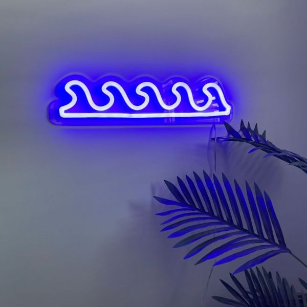 Ocean Waves Custom Neon® Sign shown in dark blue wall mounted in a living room