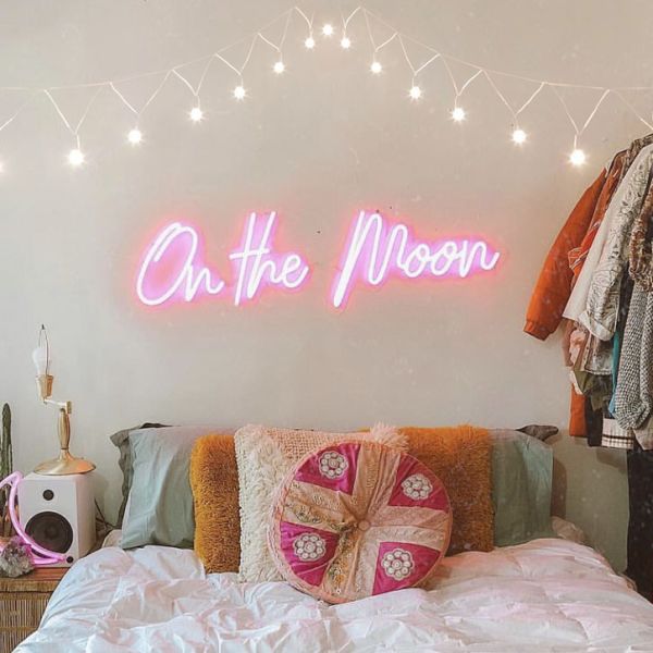 On the Moon pink light sign shown turned on - made by @customneon for @malloryonthemoon