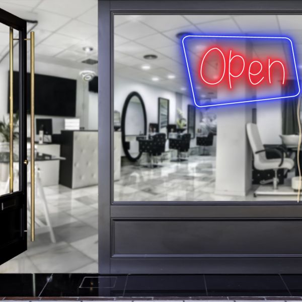 Neon look LED shop open sign in blue and red with an asymmetric outline shown in a hair salon window - from CustomNeon.co.uk