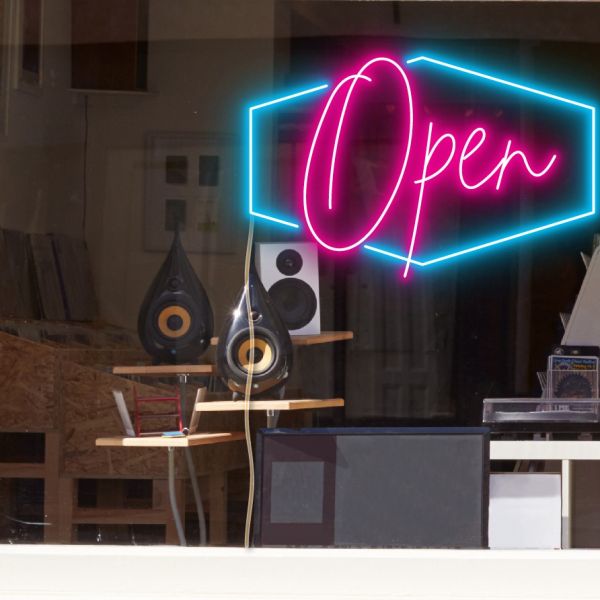 LED neon flex open sign shown in bright pink and blue with the WildSpirit font - from CustomNeon.co.uk