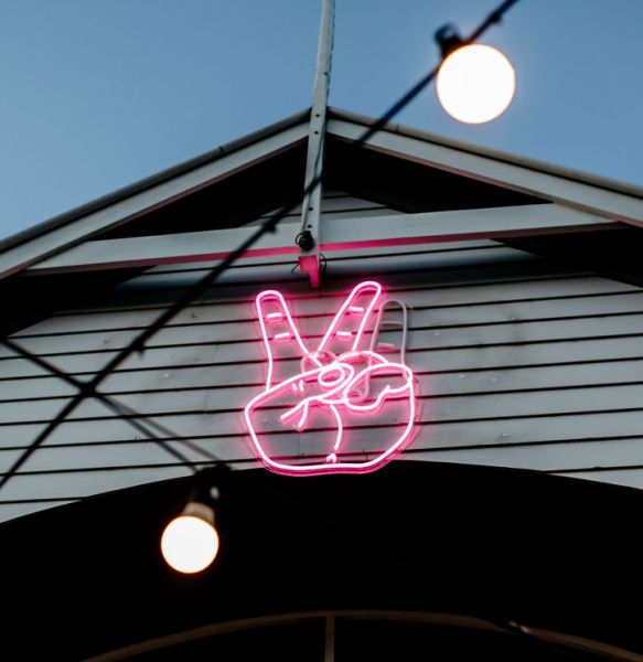 Peace Sign / Sign of the Horns Alternating Neon Sign - photos CustomNeon.com