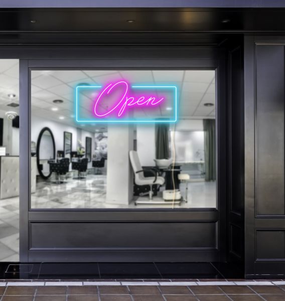 Pink LED neon open sign with a bright blue rectangular outline shown in a beauty salon window - photo CustomNeon.co.uk