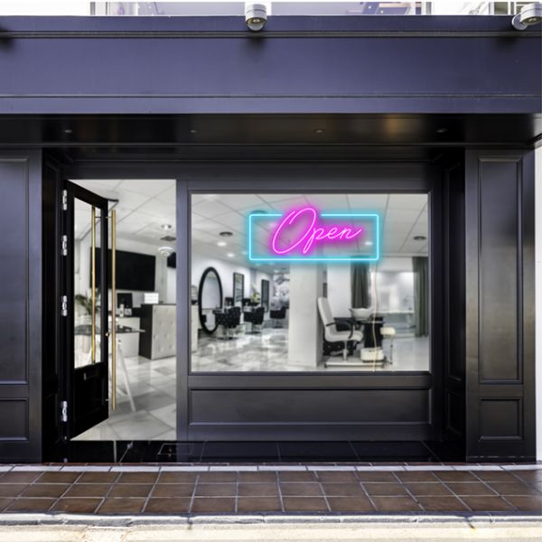 Pink open sign with a blue rectangular shown lit up on the window of a beauty salon - photo CustomNeon.co.uk