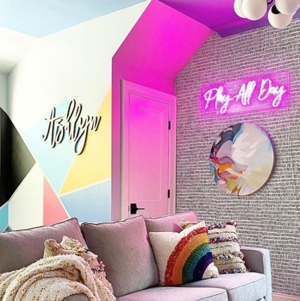 Play All Day pink Custom Neon® sign shown as living room wall art - styling/photo @shannonking_eclecticinteriors