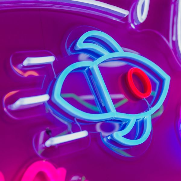 Custom Neon® rocketship artwork in blue red and white