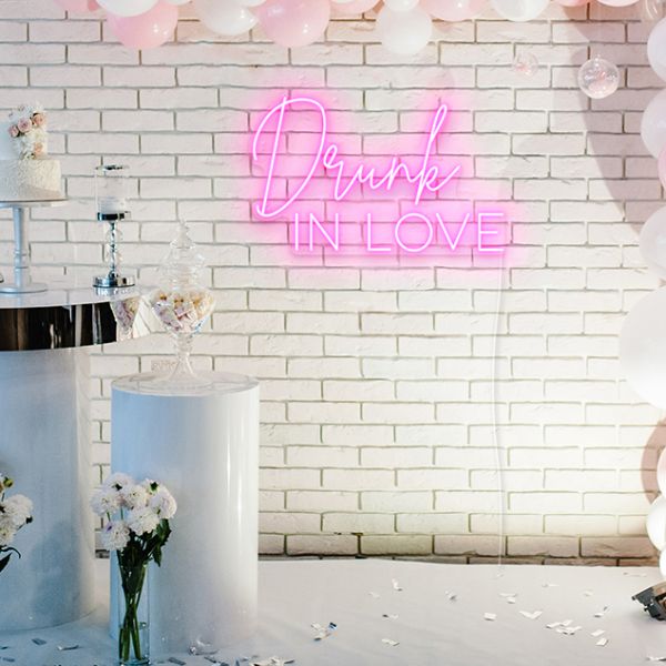 Drunk IN LOVE faux neon sign behind the bride and groom at a wedding - from Custom Neon