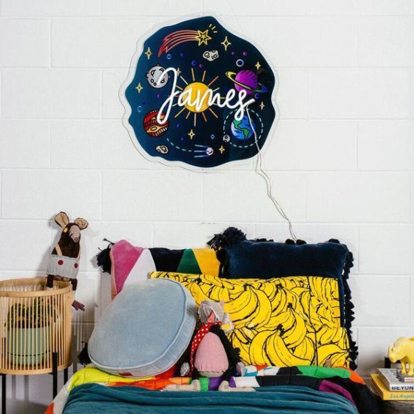 Personalised Child's Name Sign with a UV printed outer space background from CustomNeon.co.uk
