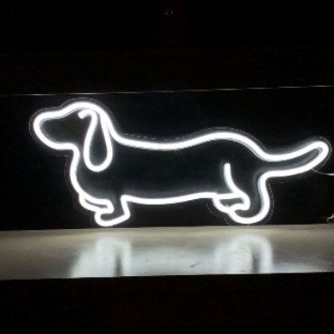 LED neon dog shown in white on a shelf  - photo from CustomNeon.co.uk
