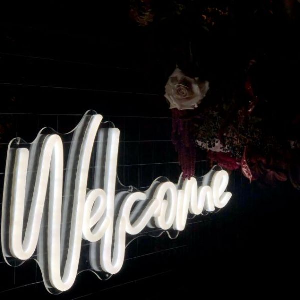 Welcome neon light shown at the entrance to an event - made by @customneon