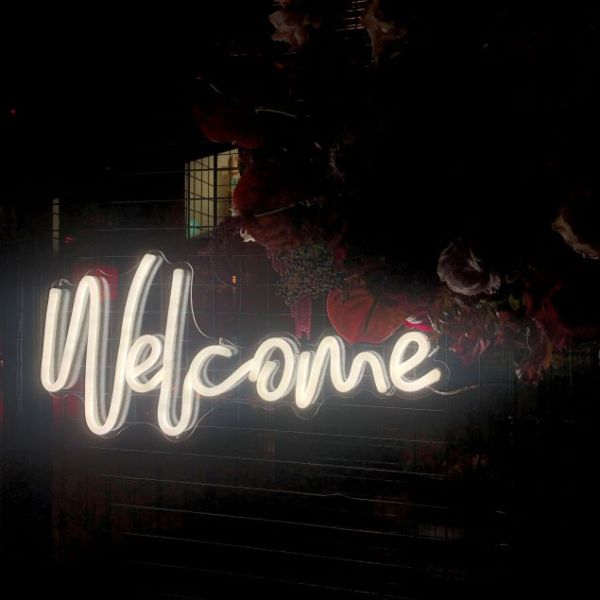 Welcome neon light shown at the entrance to an event - made by @customneon