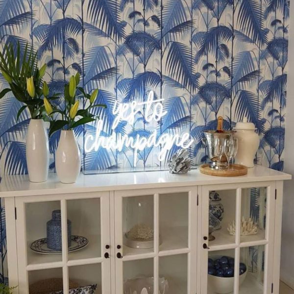 Yes to Champagne Neon Sign shown atop a sideboard - photo from CustomNeon.co.uk