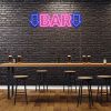Bar Sign with Arrows on brick wall - design by Custom Neon