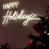 CUSTOM NEON® Happy Holidays warm white LED neon sign wall-mounted next to a Christmas tree