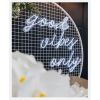 Good Vibes Only LED neon sign in 3 pieces shown on a mesh screen at an event - photo from CustomNeon.co.uk