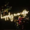 Happily Ever After LED neon sign surrounded by floral decorations - from Custom Neon