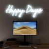 Happy Days LED neon sign shown illuminated above a monitor - photo CustomNeon.co.uk