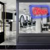 Neon look LED shop open sign in blue and red with an asymmetric outline shown in a hair salon window - from CustomNeon.co.uk