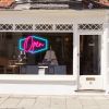 LED neon flex open sign shown in a shop window - from CustomNeon.co.uk