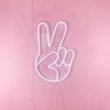 LED Neon Peace Emoji Sign Light shown on a pink wall - Photo CustomNeon.com