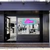 Pink open sign with a blue rectangular shown lit up on the window of a beauty salon - photo CustomNeon.co.uk