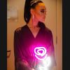 Handheld LED Neon Flower Bouquet held by a bride in her dressing room - photo from CustomNeon.co.uk