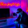 The Best Life red neon flex sign shown above a flatscreen TV in a living room @customneon