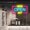 WE'RE OPEN 24/7 neon sign in yellow, blue & pink shown in a cafe window - from CustomNeon.co.uk