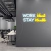 Work Hard Stay Humble in white & yellow on grey office wall - by CUSTOM NEON®