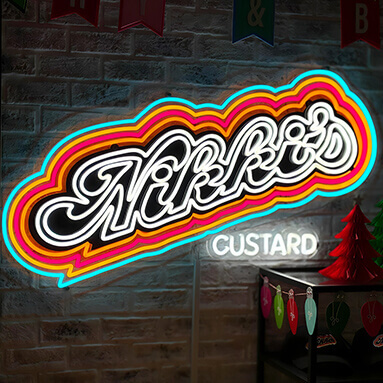 Custom Neon® vintage style multi-colored LED neon logo on brick wall @nikkiscustard