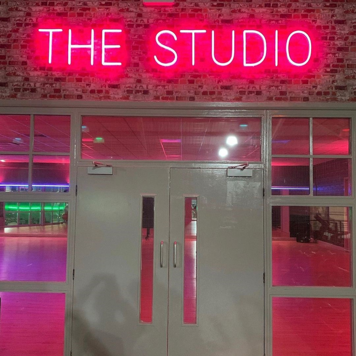 Custom Neon® pink wayfinding THE STUDIO sign @247fitnesssheffield @247fitnessgym