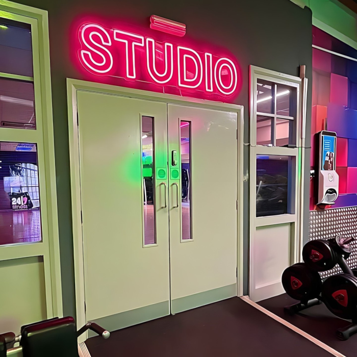 Custom Neon® pink wayfinding STUDIO sign @247fitnessyork @247fitnessgym