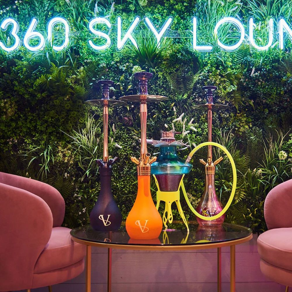 Custom Neon® restaurant name sign on greenwall @360skyloungenewcastle