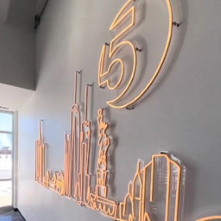 Warm white Custom Neon® artwork of the NYC skyline @5boroughbagels