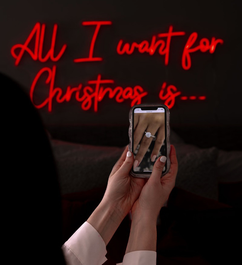 Custom Neon® red All I Want for Christmas... sign in retailer social media content