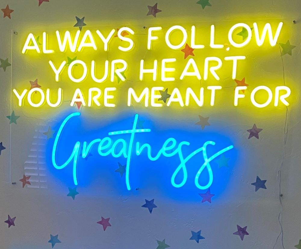 Always Follow Your Heart yellow & blue Custom Neon® sign on wallpapered wall