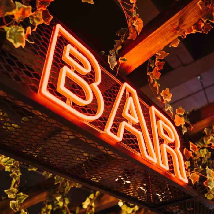 Yellow branded tagline sign @mktplce.uk made by Custom Neon® photography @brianfbenton