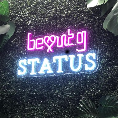 Custom Neon® Nail Salon logo sign on grass wall @beautystatus.uk