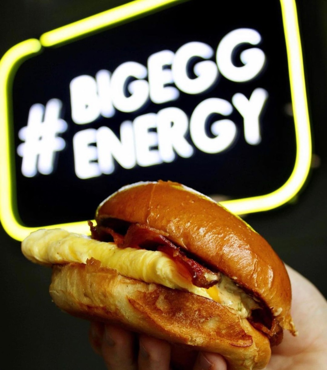 Custom Neon® pink white & yellow signs @crackedeggery