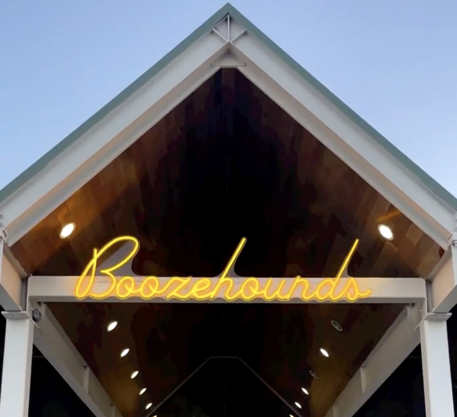 Outdoor business name sign by Custom Neon® @boozehoundsps